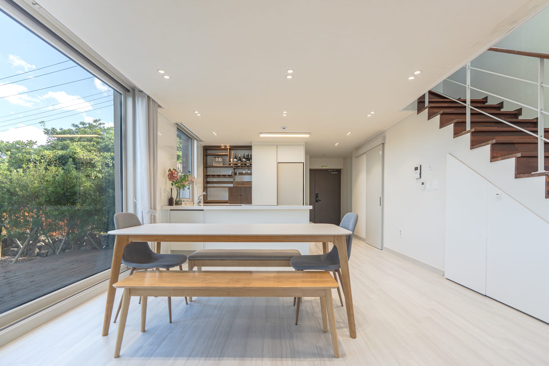 Open living hall connecting dining, kitchen and staircase